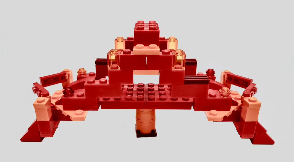 A small red bridge built from LEGO® bricks